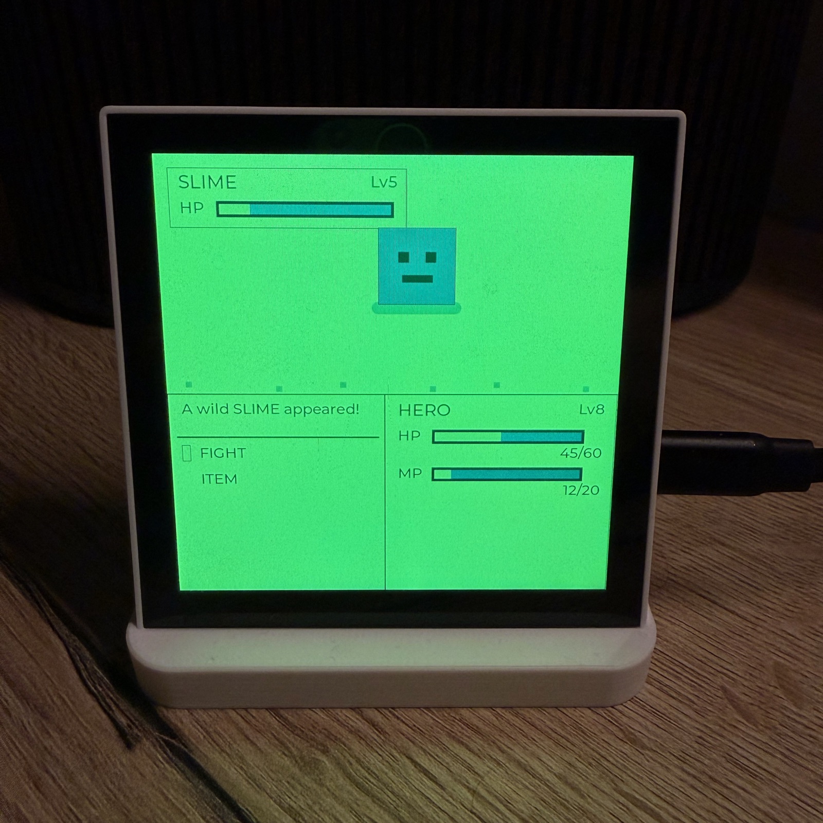 Pixel-art slime mini-game on an ESP32 panel