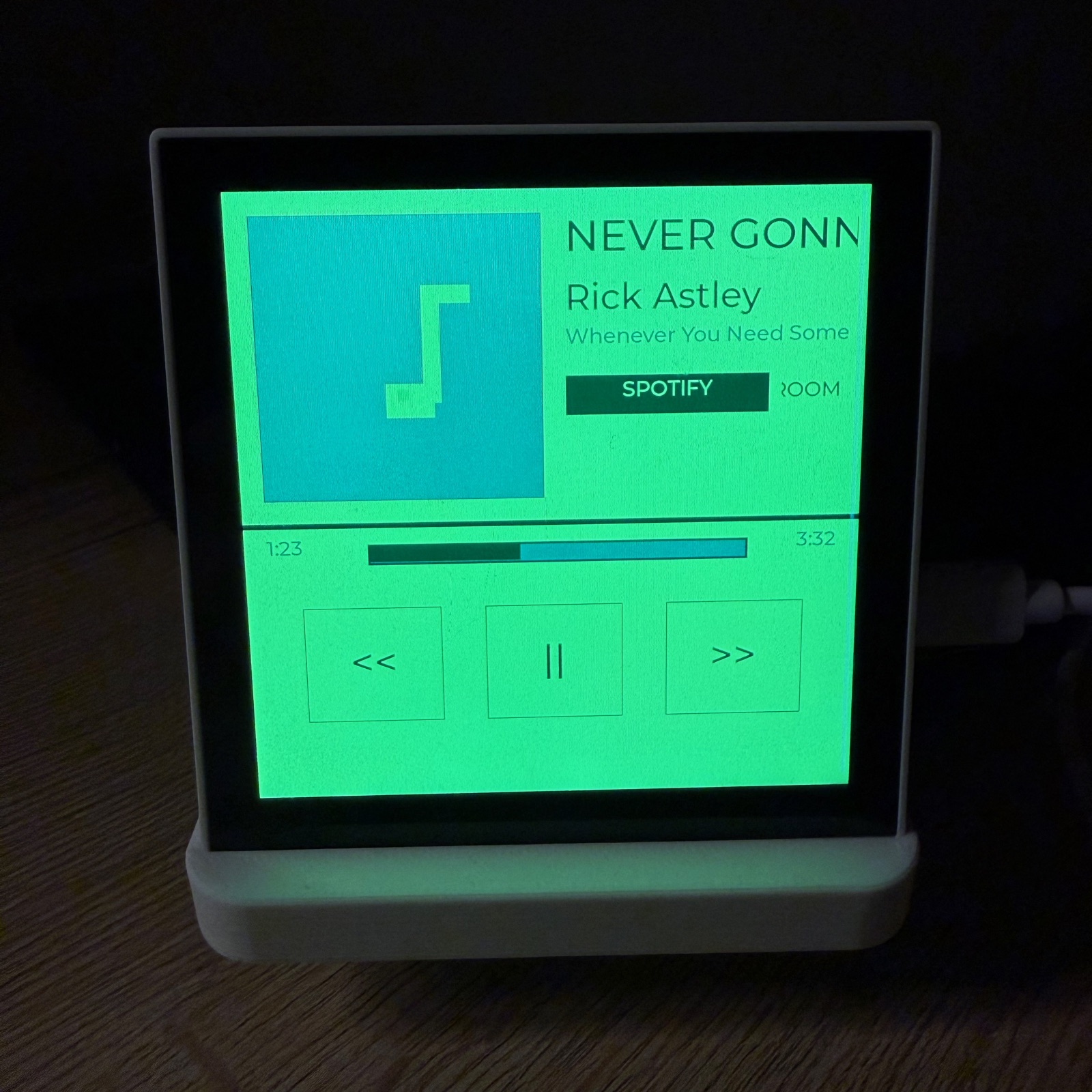 Pixel-art now-playing media screen on an ESP32 panel