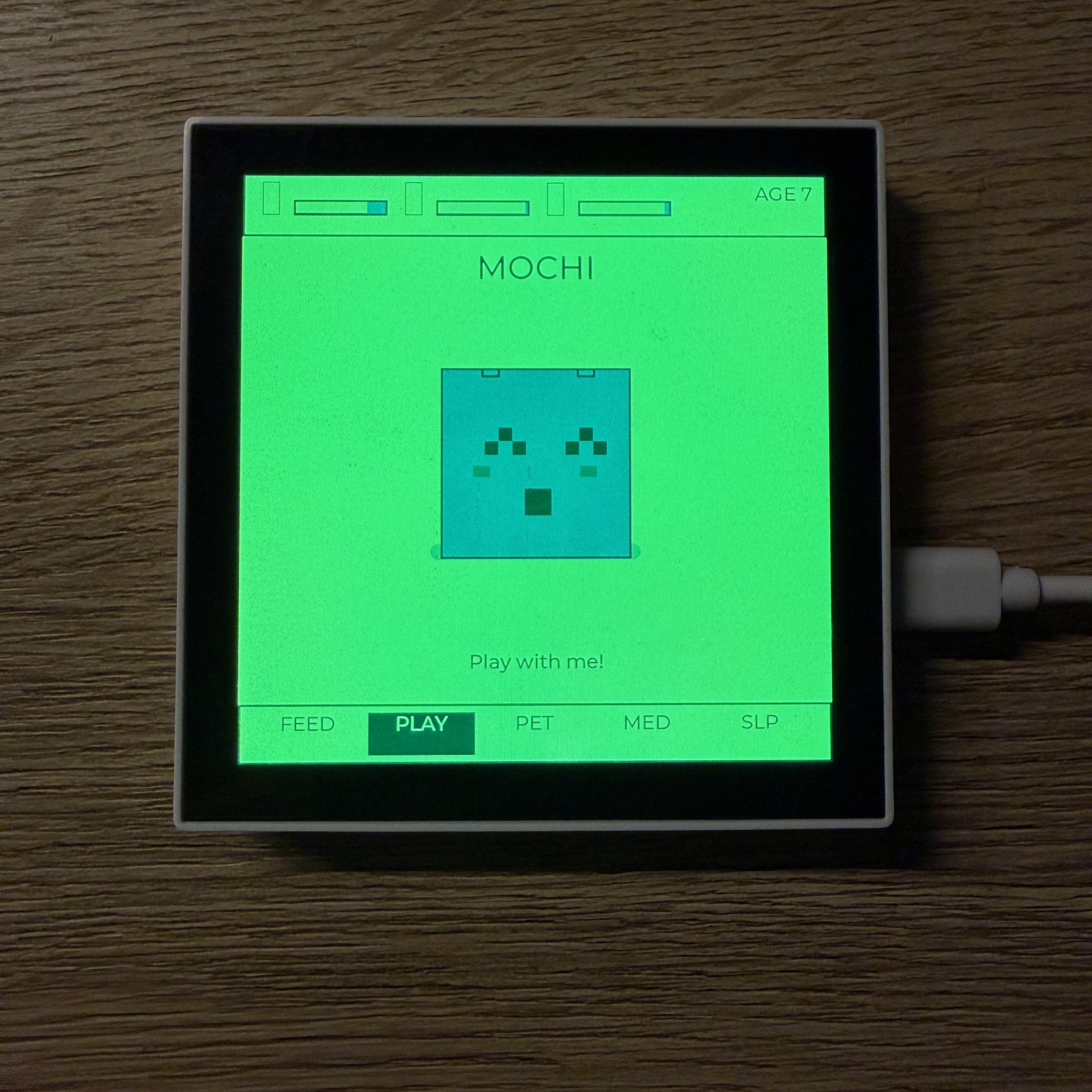 Pixel-art virtual-pet screen on an ESP32 panel